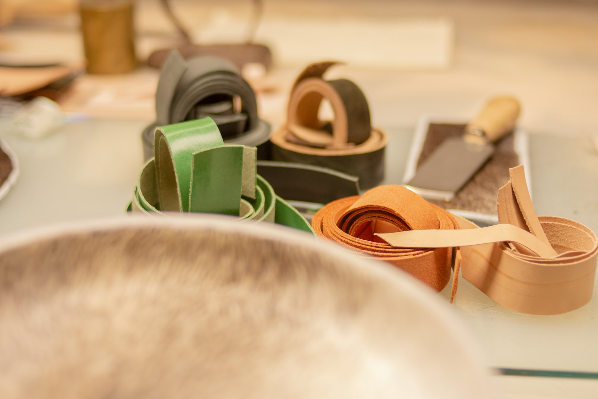 a table topped with lots of different types of belts